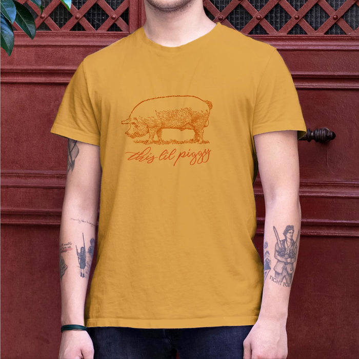 PRODUCT IMAGE: This ‘Lil Piggy T-shirt | Funny Gay SFW Tee for Horny Gay Guys | Model wears Mustard shirt