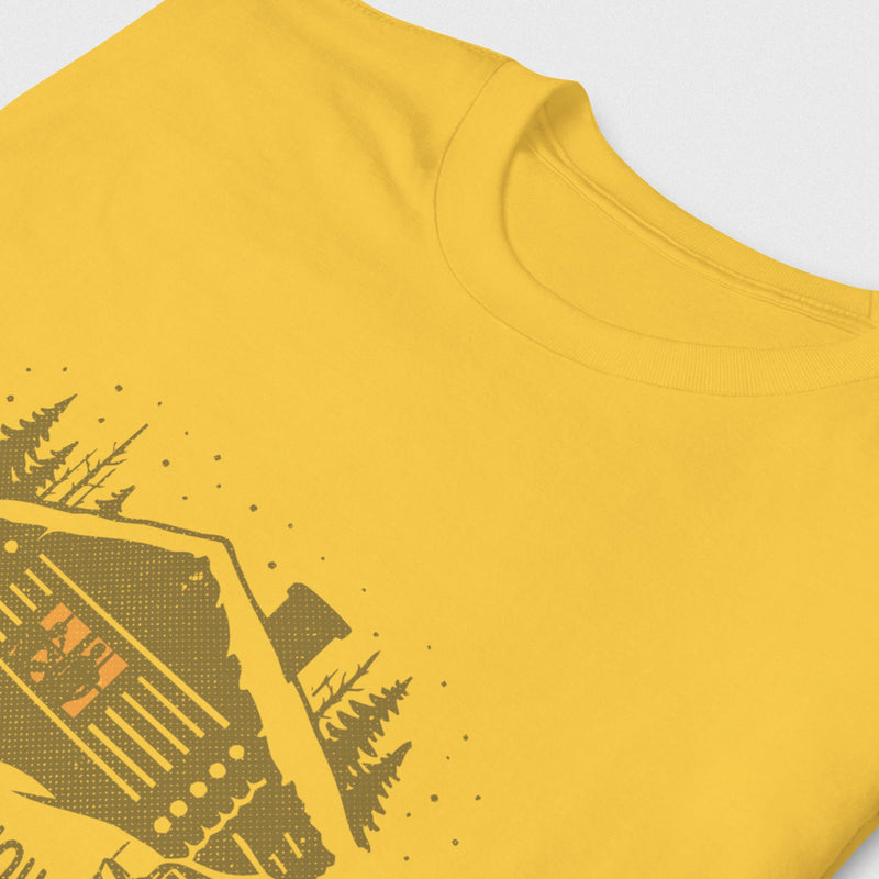 Men’s graphic t-shirt showing a snowy log cabin and plow truck, featuring the phrase “Snowed In, Plowed Out,” a subtle innuendo design for gay men; close-up product photo of Daisy tee.