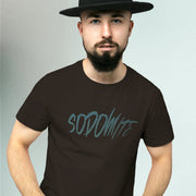 PRODUCT IMAGE: Sodomite T-Shirt | Raunchy Tee for Horny Gay Men & Queer Rebels | Model wears Brown  shirt with typographic design