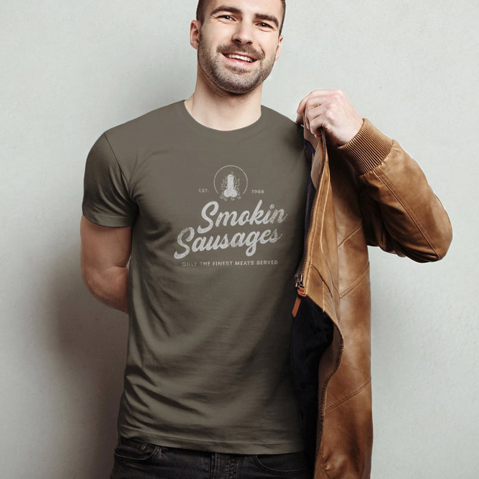 PRODUCT IMAGE: Smokin Sausages T-shirt | Funny, Raunchy T-shirts for Horny Gay Guys | Model wears Army shirt with vintage-style faux logo design