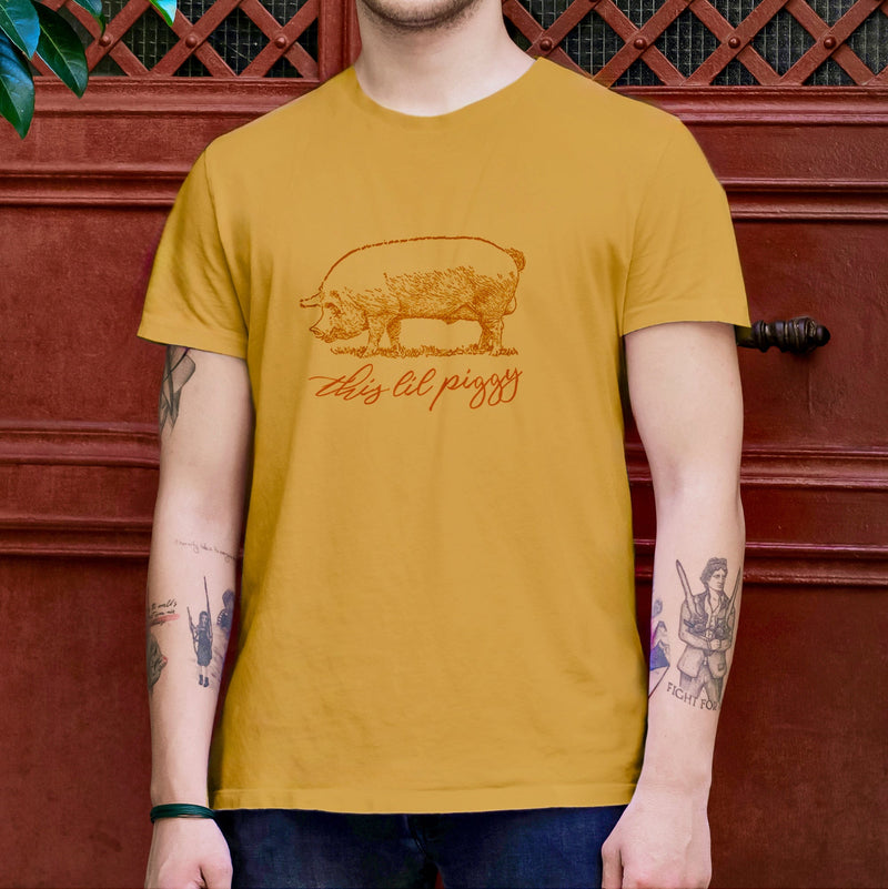 PRODUCT IMAGE: This ‘Lil Piggy T-shirt | Funny Gay SFW Tee for Horny Gay Guys | Model wears Mustard shirt
