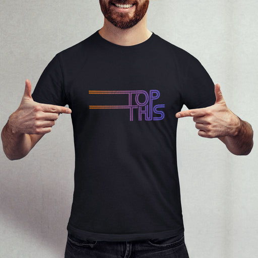 Man pointing to a black t-shirt with 'TOP THIS' typographic design | Discreetly Raunchy tees for horny gay bottom guys