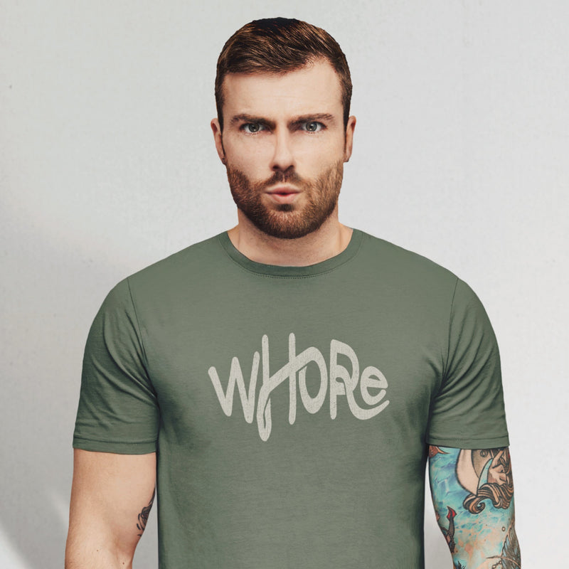 PRODUCT IMAGE: Whore | Offensive NSFW T-shirt for Horny Gay Guys | Typographic Design | model w/ military green shirt